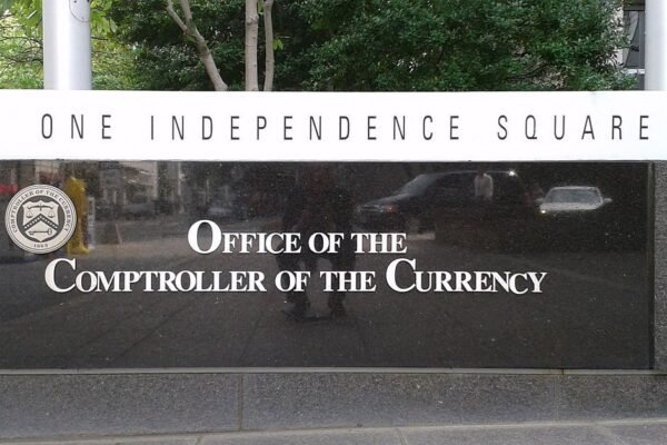 A sign outside the OCC office (CoinDesk)